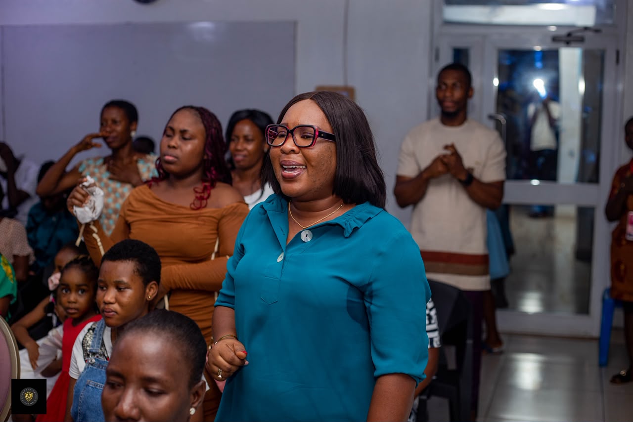Sweet Fragrance Church member worshipping during a gathering